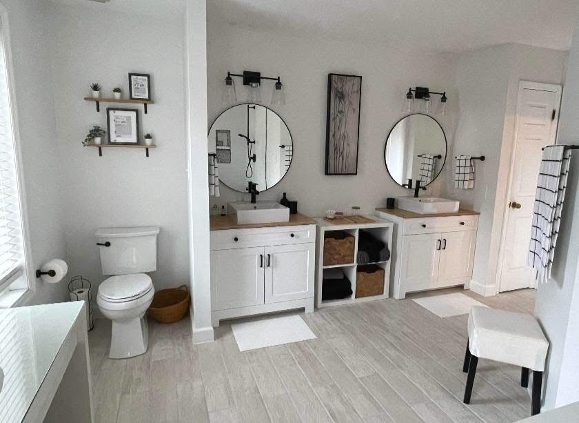Bright remodeled bathroom with dual vanities