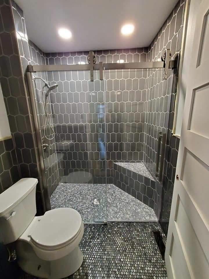 Custom tiled shower with glass doors